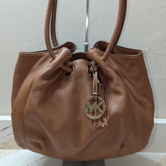 MICHAEL Michael Kors Handbags - Michael Kors Camden with tassel and cinch straps. EUC!